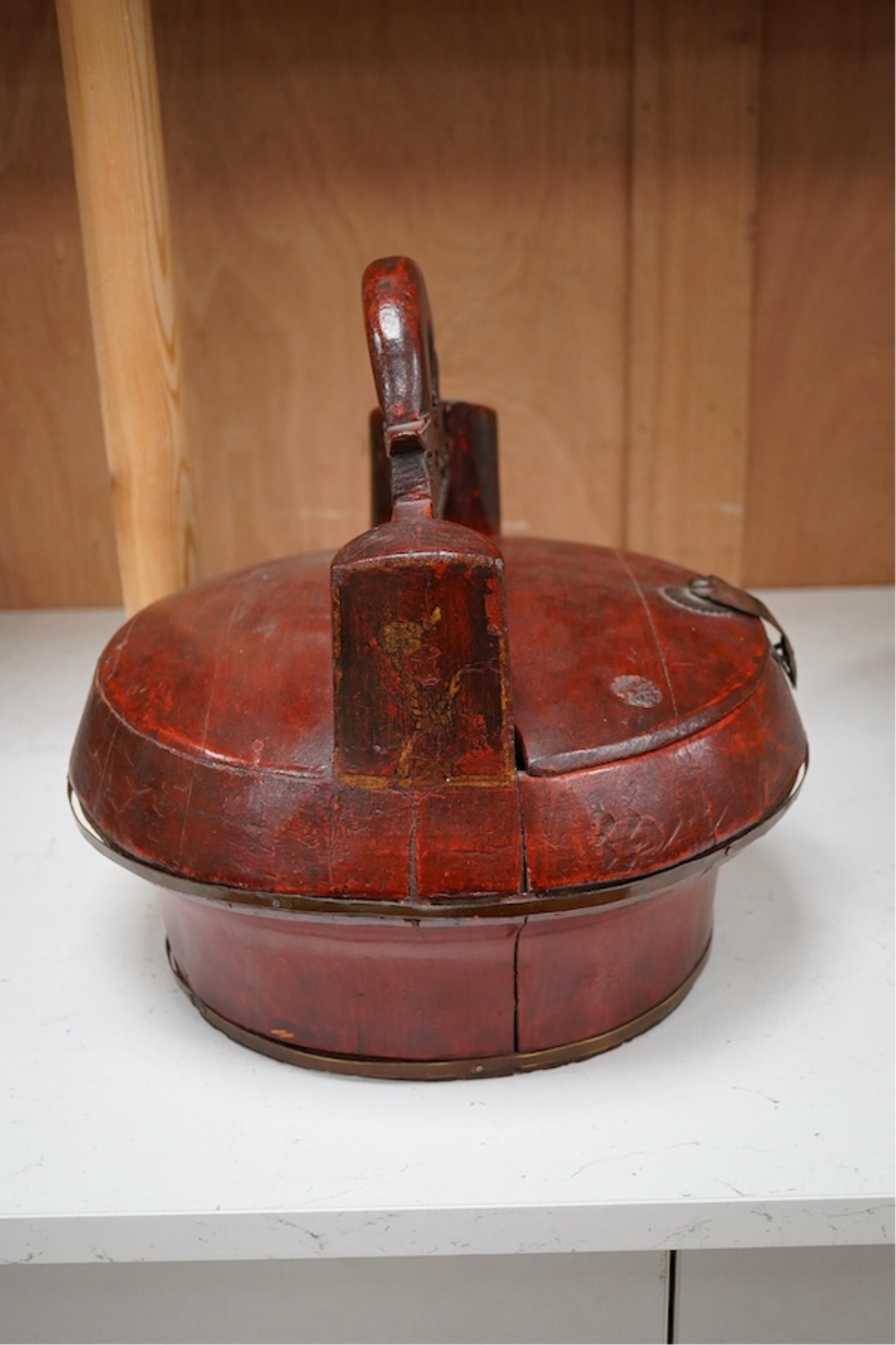 A Chinese red stained and carved food box, 29.5cm high. Condition - fair